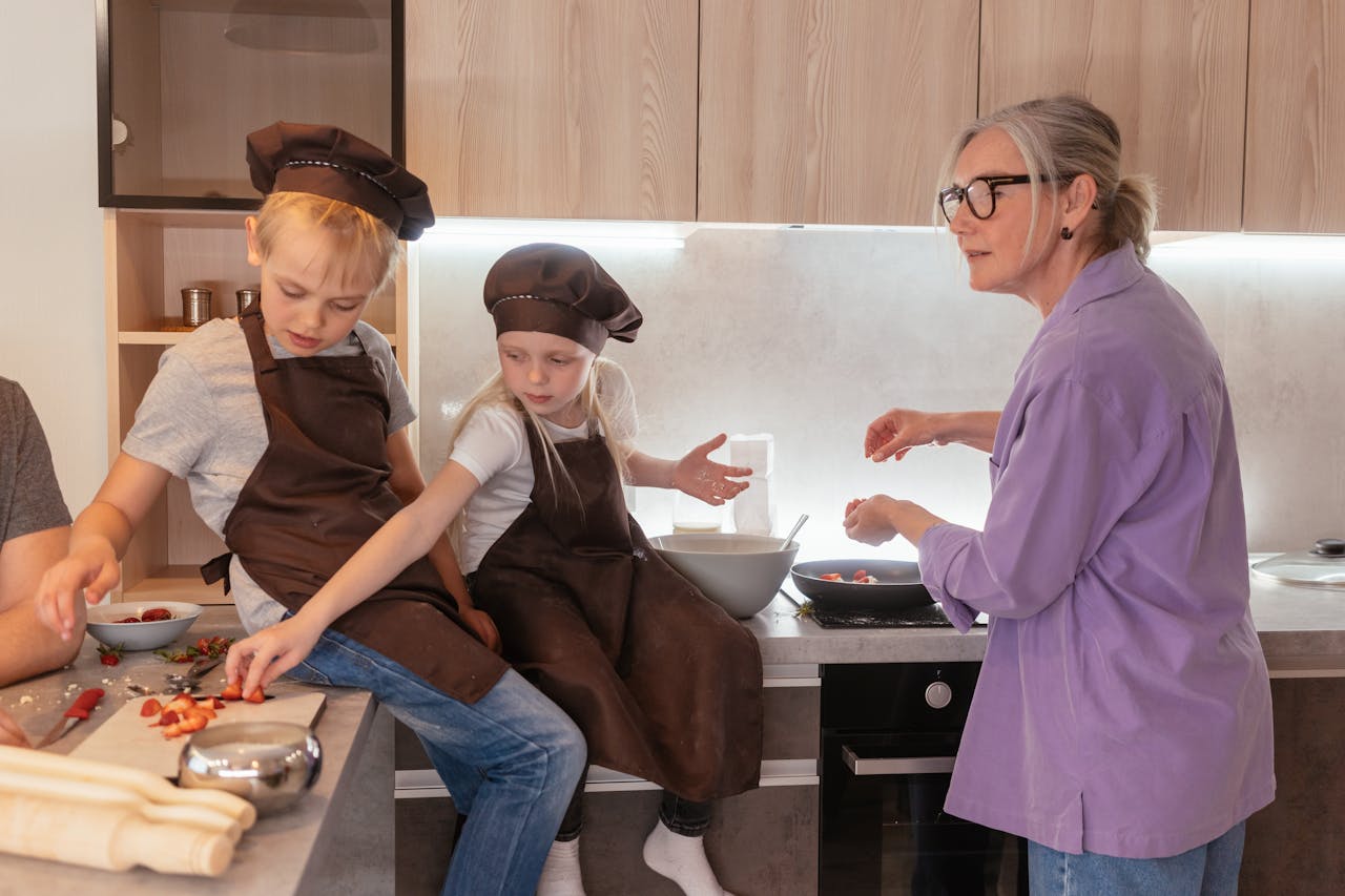 why-choose-us Elderly woman and children cooking together, fostering family bonding.